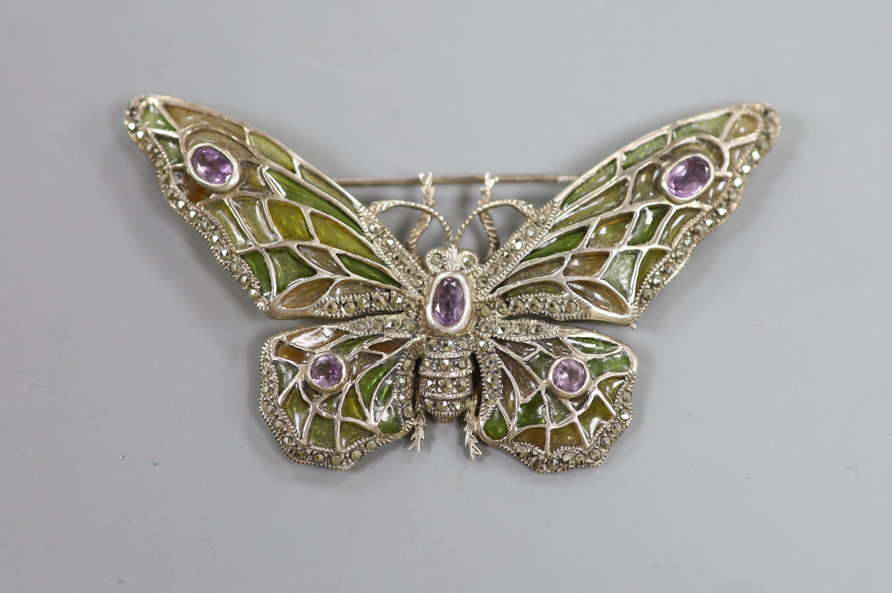 A 20th century 925 white metal, amethyst, marcasite and plique a jour set butterfly brooch